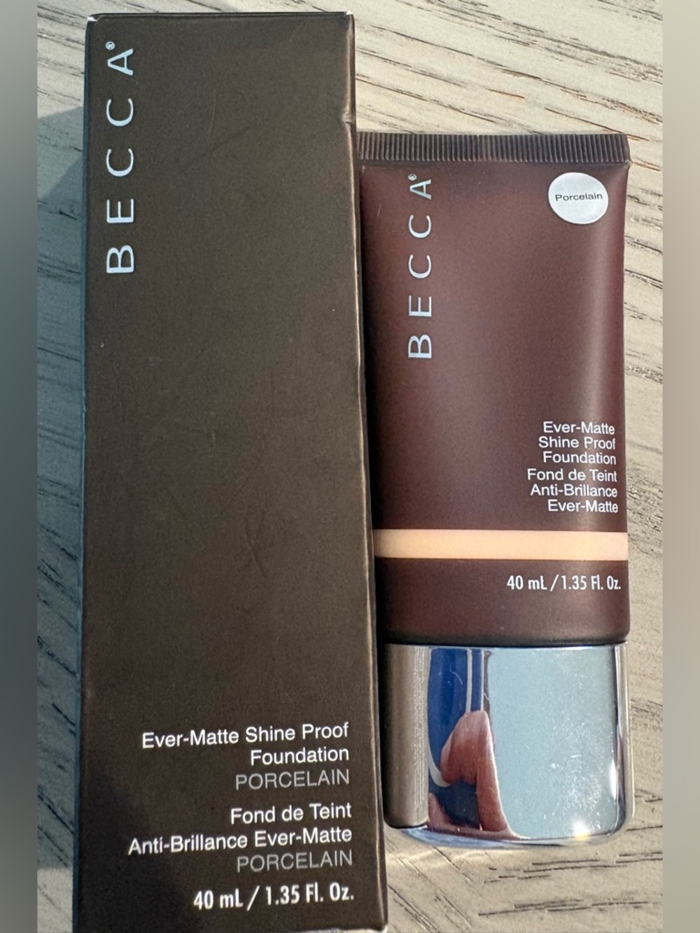 BECCA Ever-Matte Shine Proof Foundation — Porcelain (brown tube, silver cap)
